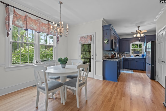 22 Mallet Hill Ct, Columbia, SC 29223 - dining space with a chandelier, ornamental molding, ceiling fan, and light wood-type flooring