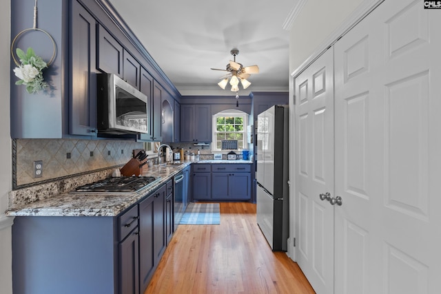 22 Mallet Hill Ct, Columbia, SC 29223 - kitchen with stainless steel appliances, light wood finished floors, ornamental molding, light stone counters, and a ceiling fan