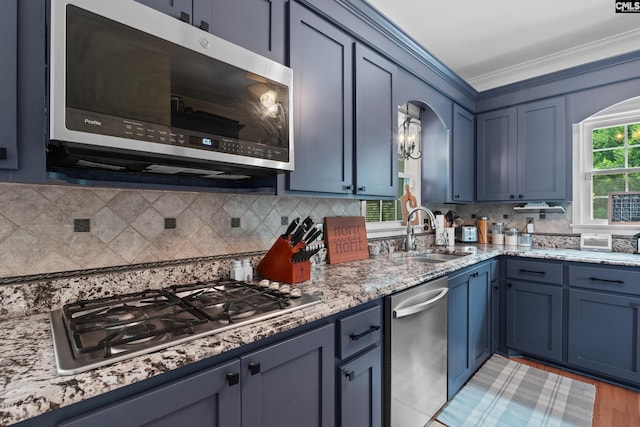 22 Mallet Hill Ct, Columbia, SC 29223 - kitchen with a sink, appliances with stainless steel finishes, ornamental molding, blue cabinets, and backsplash