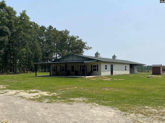 290 Gunter Pond Rd, Wagener, SC 29164 - rear view of property with a lawn and board and batten siding