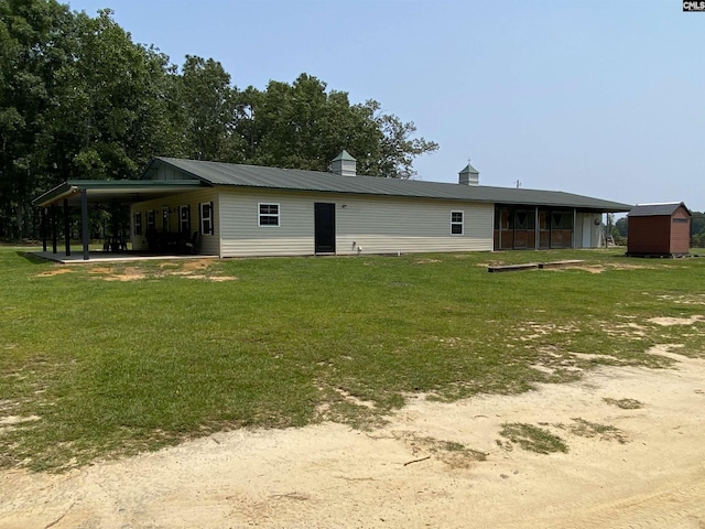 290 Gunter Pond Rd, Wagener, SC 29164 - back of house featuring a yard and an attached carport