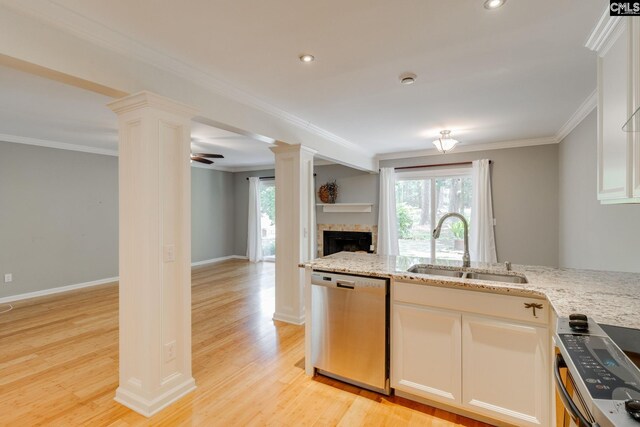 201 Mariners Row, Columbia, SC 29212 - kitchen featuring stainless steel dishwasher, decorative columns, a sink, range, and a fireplace