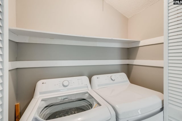 201 Mariners Row, Columbia, SC 29212 - laundry area with washing machine and dryer and a textured ceiling