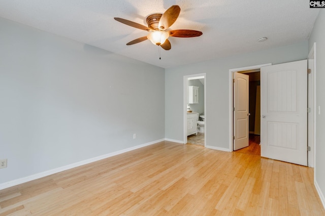 201 Mariners Row, Columbia, SC 29212 - unfurnished bedroom with light wood-type flooring, baseboards, ensuite bath, and a ceiling fan