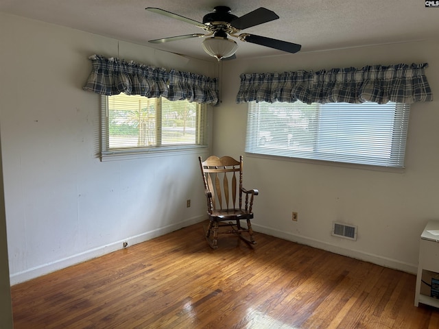 1147 Gunter Cir, West Columbia, SC 29169 - living area featuring wood finished floors, a ceiling fan, and baseboards