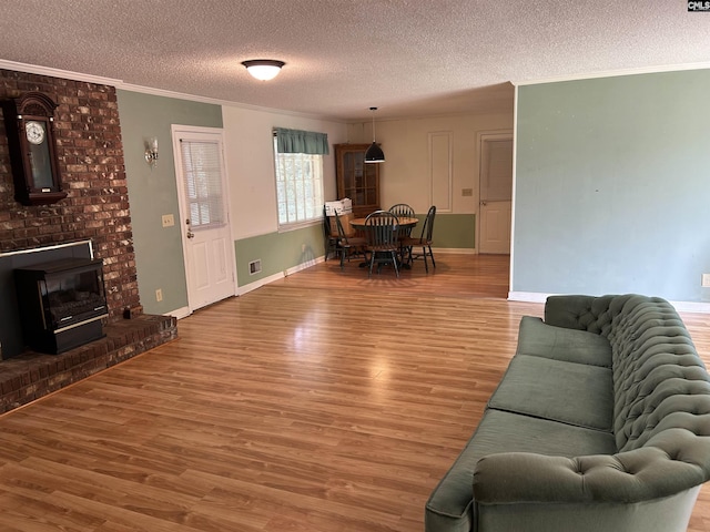 1147 Gunter Cir, West Columbia, SC 29169 - living area featuring a textured ceiling, wood finished floors, ornamental molding, and baseboards