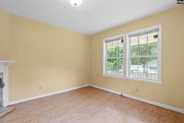 114 Quattlebaum Ave, Ridge Spring, SC 29129 - unfurnished living room featuring plenty of natural light, light wood finished floors, and baseboards