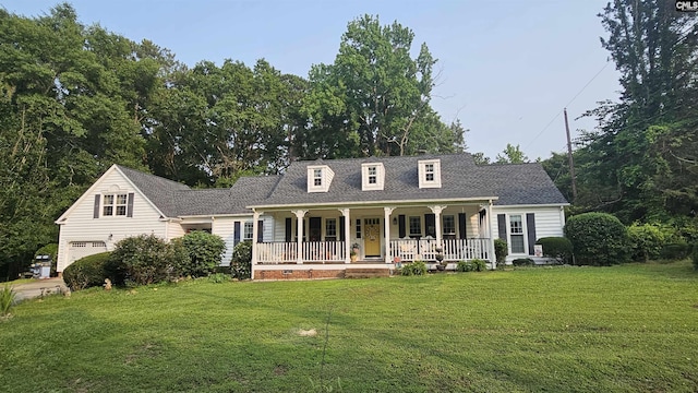 310 Andrew Corley Rd, Lexington, SC 29072 - new england style home featuring covered porch, a front yard, and an attached garage