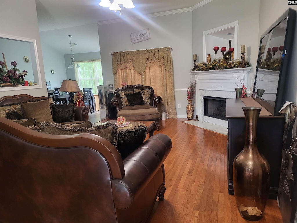 211 Alderston Way, Columbia, SC 29229 - living room featuring a fireplace with flush hearth, ornamental molding, and hardwood / wood-style flooring