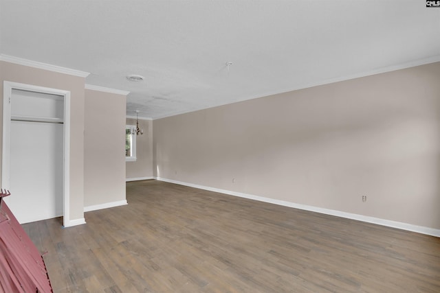 4712 Leaf Crest Ct, Columbia, SC 29210 - unfurnished living room featuring crown molding, wood finished floors, a chandelier, and baseboards