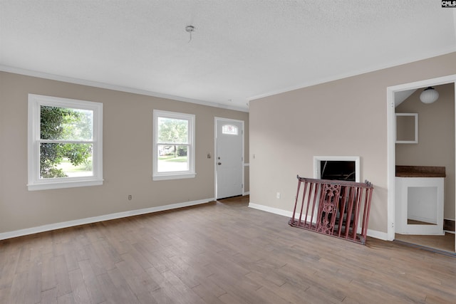 4712 Leaf Crest Ct, Columbia, SC 29210 - unfurnished living room featuring ornamental molding, wood finished floors, and baseboards