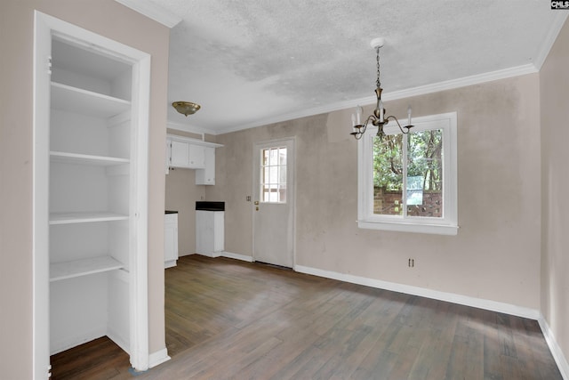 4712 Leaf Crest Ct, Columbia, SC 29210 - unfurnished dining area featuring a chandelier, dark wood-style flooring, baseboards, plenty of natural light, and crown molding