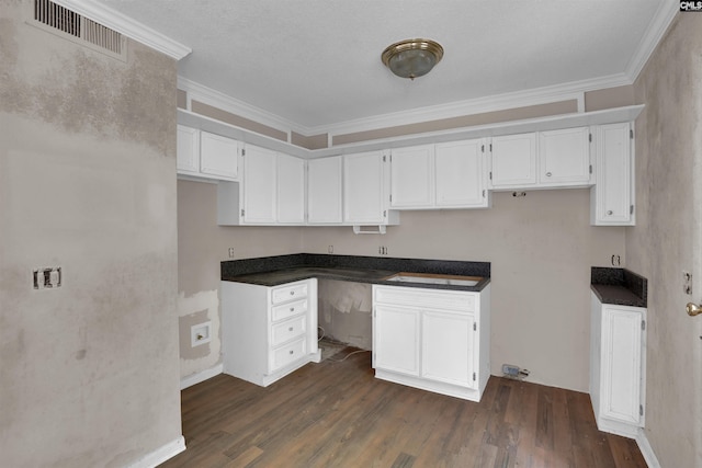 4712 Leaf Crest Ct, Columbia, SC 29210 - kitchen featuring dark wood finished floors, white cabinets, ornamental molding, and dark countertops