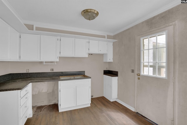 4712 Leaf Crest Ct, Columbia, SC 29210 - kitchen featuring dark countertops, white cabinets, wood finished floors, and crown molding