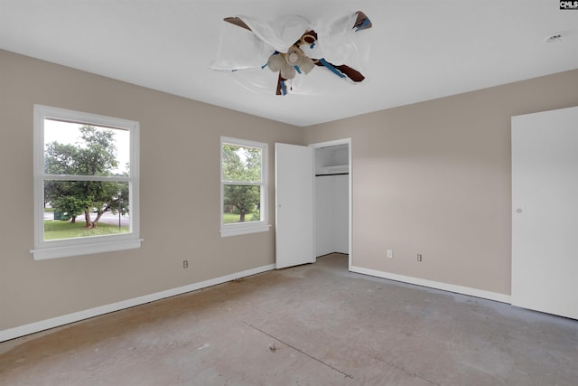 4712 Leaf Crest Ct, Columbia, SC 29210 - unfurnished bedroom featuring baseboards, concrete floors, and ceiling fan