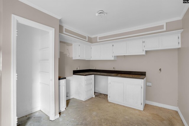 4712 Leaf Crest Ct, Columbia, SC 29210 - kitchen featuring concrete floors, white cabinetry, crown molding, baseboards, and dark countertops