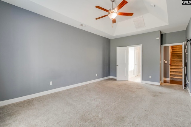 571 Maple Valley Loop, Blythewood, SC 29016 - unfurnished bedroom with a raised ceiling, light carpet, baseboards, ceiling fan, and ensuite bath