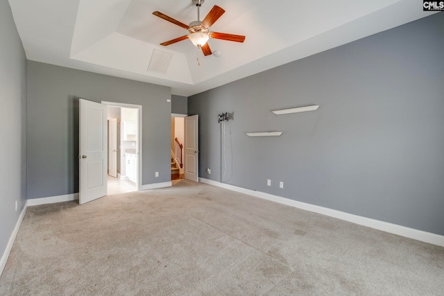 571 Maple Valley Loop, Blythewood, SC 29016 - unfurnished bedroom featuring a tray ceiling, light colored carpet, baseboards, and a ceiling fan