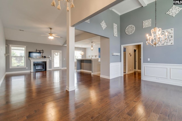 571 Maple Valley Loop, Blythewood, SC 29016 - living area featuring a high ceiling, healthy amount of natural light, a chandelier, ceiling fan, and dark wood-style floors