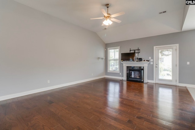 571 Maple Valley Loop, Blythewood, SC 29016 - unfurnished living room featuring vaulted ceiling, wood finished floors, baseboards, ceiling fan, and a fireplace with flush hearth