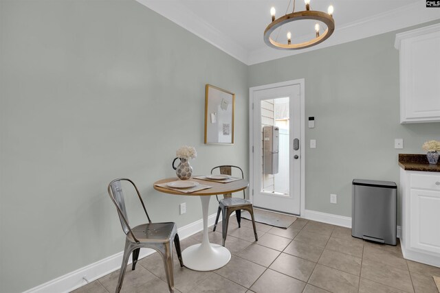 813 Forest Park Rd, Columbia, SC 29209 - dining room featuring a chandelier, baseboards, light tile patterned floors, and ornamental molding