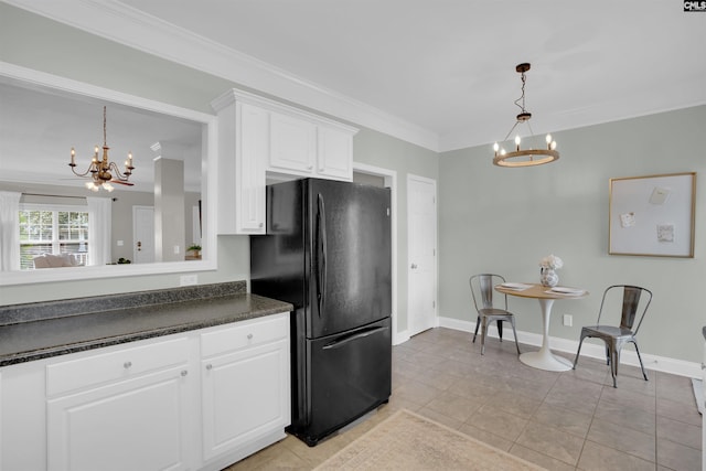 813 Forest Park Rd, Columbia, SC 29209 - kitchen featuring a chandelier, freestanding refrigerator, dark countertops, ornamental molding, and white cabinets
