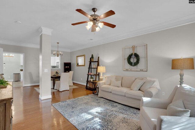 813 Forest Park Rd, Columbia, SC 29209 - living area featuring a chandelier, a ceiling fan, light wood-style floors, crown molding, and baseboards