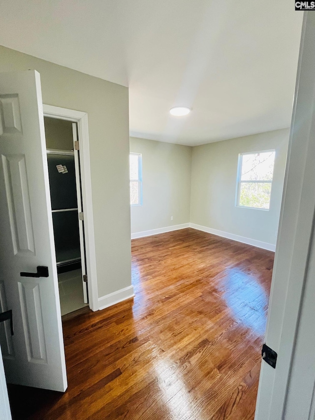1626 Van Lingle Ave, Columbia, SC 29210 - unfurnished room featuring wood finished floors, plenty of natural light, and baseboards