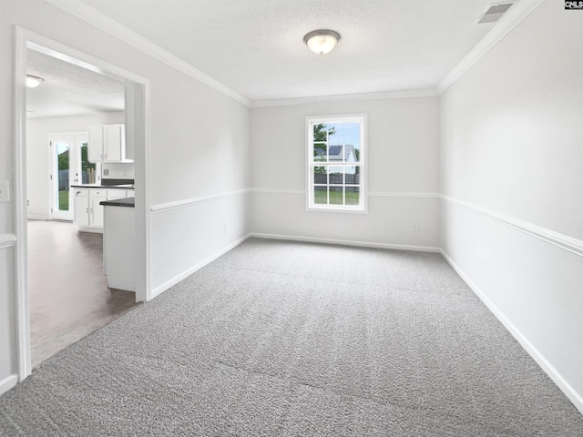 186 Fallstaff Rd, Columbia, SC 29229 - carpeted spare room featuring ornamental molding, baseboards, and a textured ceiling