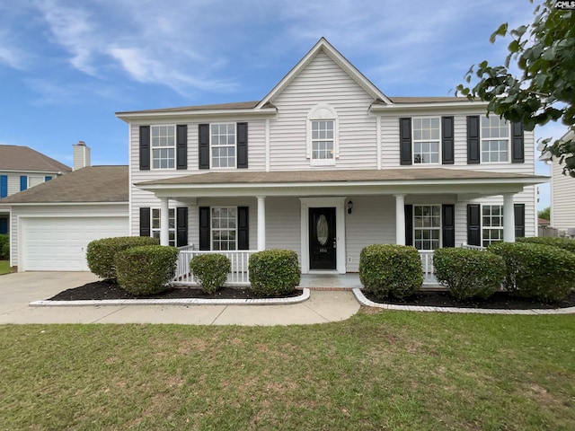 186 Fallstaff Rd, Columbia, SC 29229 - colonial-style house featuring an attached garage, driveway, covered porch, and a front yard