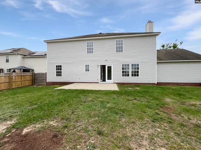 186 Fallstaff Rd, Columbia, SC 29229 - back of property featuring a chimney and a patio area