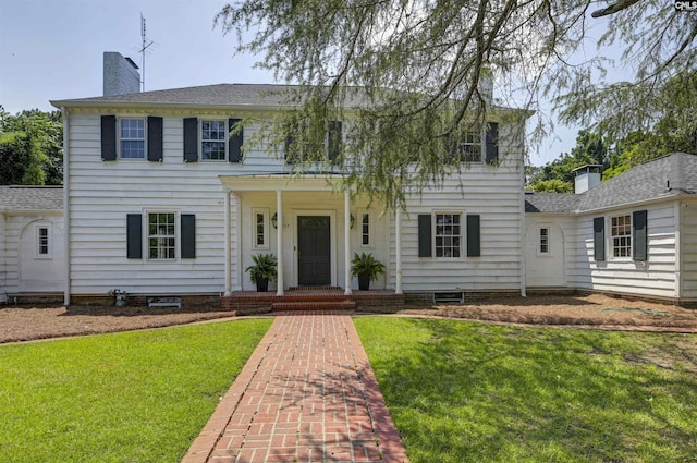 723 Hampton Hill Rd, Columbia, SC 29209 - colonial-style house featuring a chimney, a front yard, and roof with shingles
