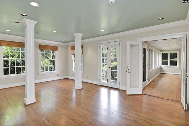723 Hampton Hill Rd, Columbia, SC 29209 - unfurnished living room featuring decorative columns, baseboards, plenty of natural light, crown molding, and recessed lighting