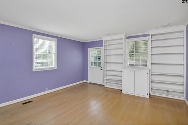 723 Hampton Hill Rd, Columbia, SC 29209 - unfurnished bedroom featuring wood finished floors, crown molding, and baseboards