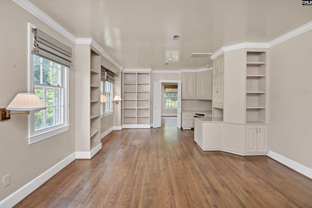 723 Hampton Hill Rd, Columbia, SC 29209 - unfurnished living room with baseboards, wood finished floors, built in features, and crown molding
