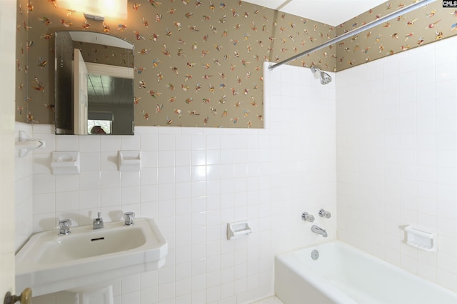 723 Hampton Hill Rd, Columbia, SC 29209 - bathroom featuring wallpapered walls, tile walls, a sink, and bathtub / shower combination