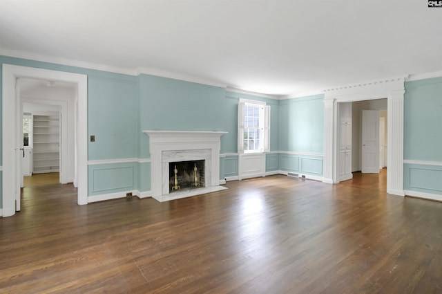 723 Hampton Hill Rd, Columbia, SC 29209 - unfurnished living room featuring a decorative wall, ornamental molding, a premium fireplace, and dark wood-style flooring