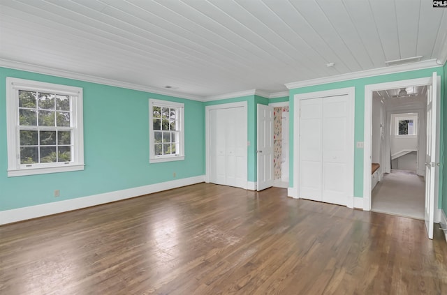 723 Hampton Hill Rd, Columbia, SC 29209 - unfurnished bedroom featuring two closets, crown molding, wood finished floors, baseboards, and wooden ceiling