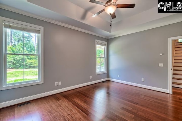 120 Mclaw Ln, Gilbert, SC 29054 - empty room featuring healthy amount of natural light, baseboards, wood finished floors, and crown molding