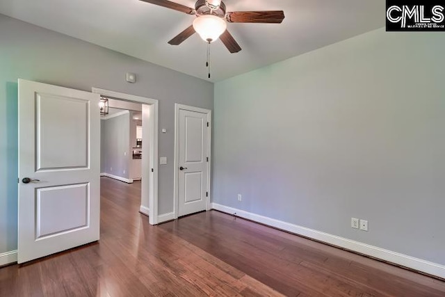 120 Mclaw Ln, Gilbert, SC 29054 - unfurnished bedroom featuring baseboards and dark wood-style flooring