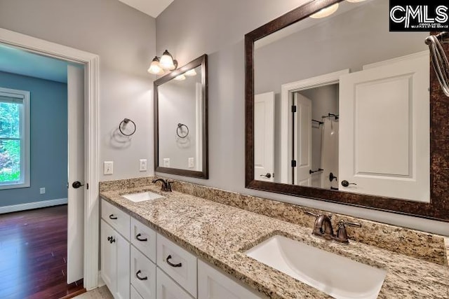 120 Mclaw Ln, Gilbert, SC 29054 - bathroom with double vanity and wood finished floors