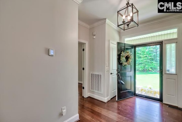 120 Mclaw Ln, Gilbert, SC 29054 - entryway with ornamental molding, a chandelier, dark wood-style flooring, and baseboards