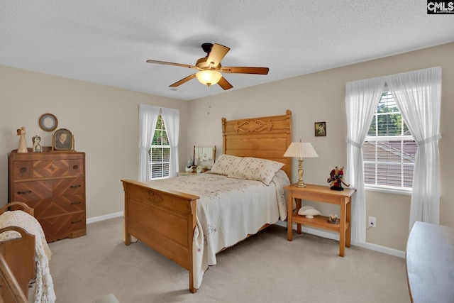 24 Stoney Pointe Dr, Chapin, SC 29036 - bedroom with light carpet, multiple windows, baseboards, and a textured ceiling
