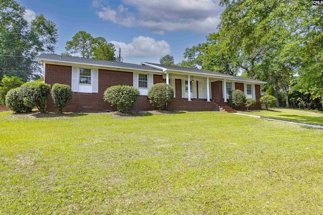 1109 F Ave, Cayce, SC 29033 - ranch-style home featuring covered porch, a front yard, and brick siding
