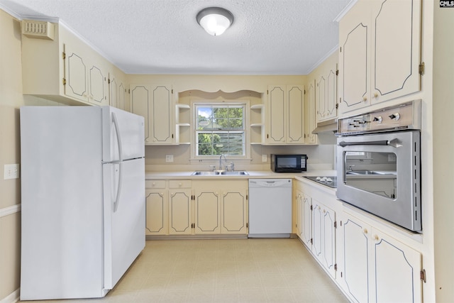1109 F Ave, Cayce, SC 29033 - kitchen featuring black appliances, a sink, open shelves, a textured ceiling, and light floors
