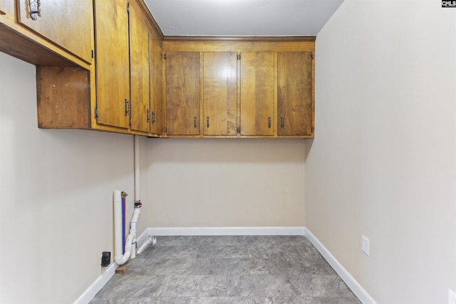 1109 F Ave, Cayce, SC 29033 - washroom featuring baseboards and cabinet space