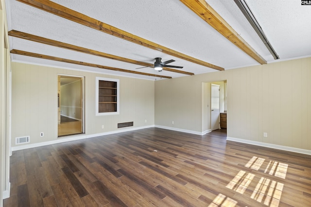 1109 F Ave, Cayce, SC 29033 - empty room with beamed ceiling, a ceiling fan, wood finished floors, a textured ceiling, and baseboards