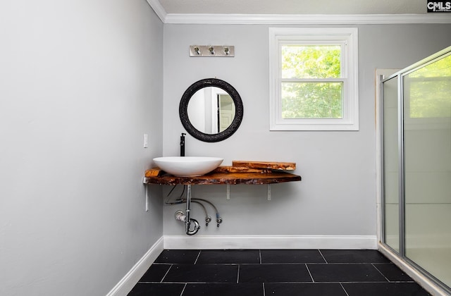 3715 Palmetto Ave, Columbia, SC 29203 - bathroom with a sink, baseboards, a shower stall, crown molding, and tile patterned floors