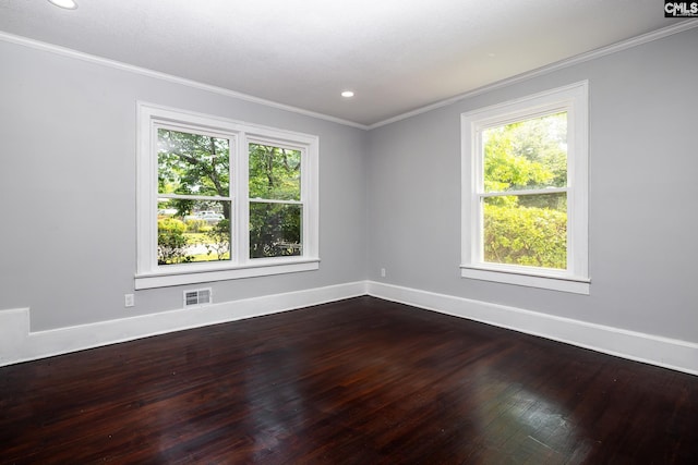 3715 Palmetto Ave, Columbia, SC 29203 - empty room with plenty of natural light, dark wood finished floors, baseboards, crown molding, and recessed lighting