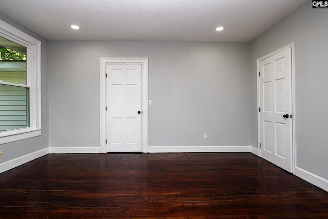 3715 Palmetto Ave, Columbia, SC 29203 - spare room featuring dark wood-type flooring, recessed lighting, and baseboards